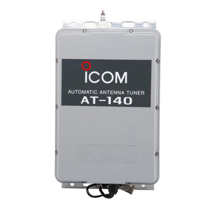 Front view of the white Icom AT140 automatic antenna tuner displaying its weather resistant acrylic case housing and top wire terminal post.