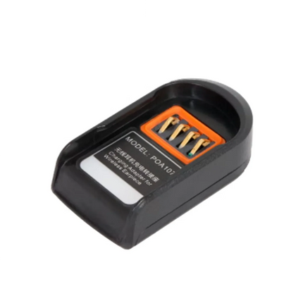 Close-up of the included POA107 charging adapter cradle housing the Hytera ESW01 wireless Bluetooth earpiece unit.