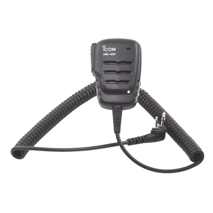 An Icom HM-221 handheld microphone with a coiled black cord and attached adapter, shown against a plain white background.