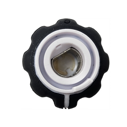 A close-up of a black and white plastic cap or connector with a threaded metal center, isolated on a white background.