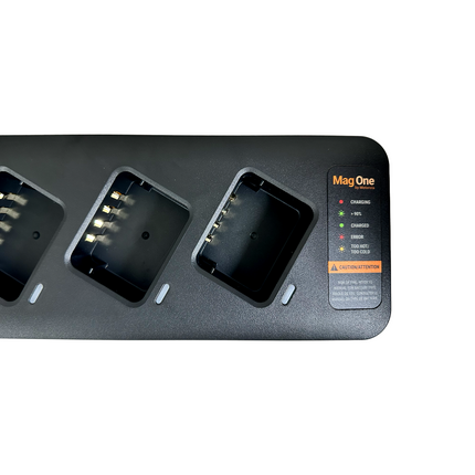 Overhead view of the empty battery docking bays and individual LED status indicators on the Motorola PMLN8893A multi-charger.